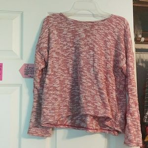 A red sweater with white